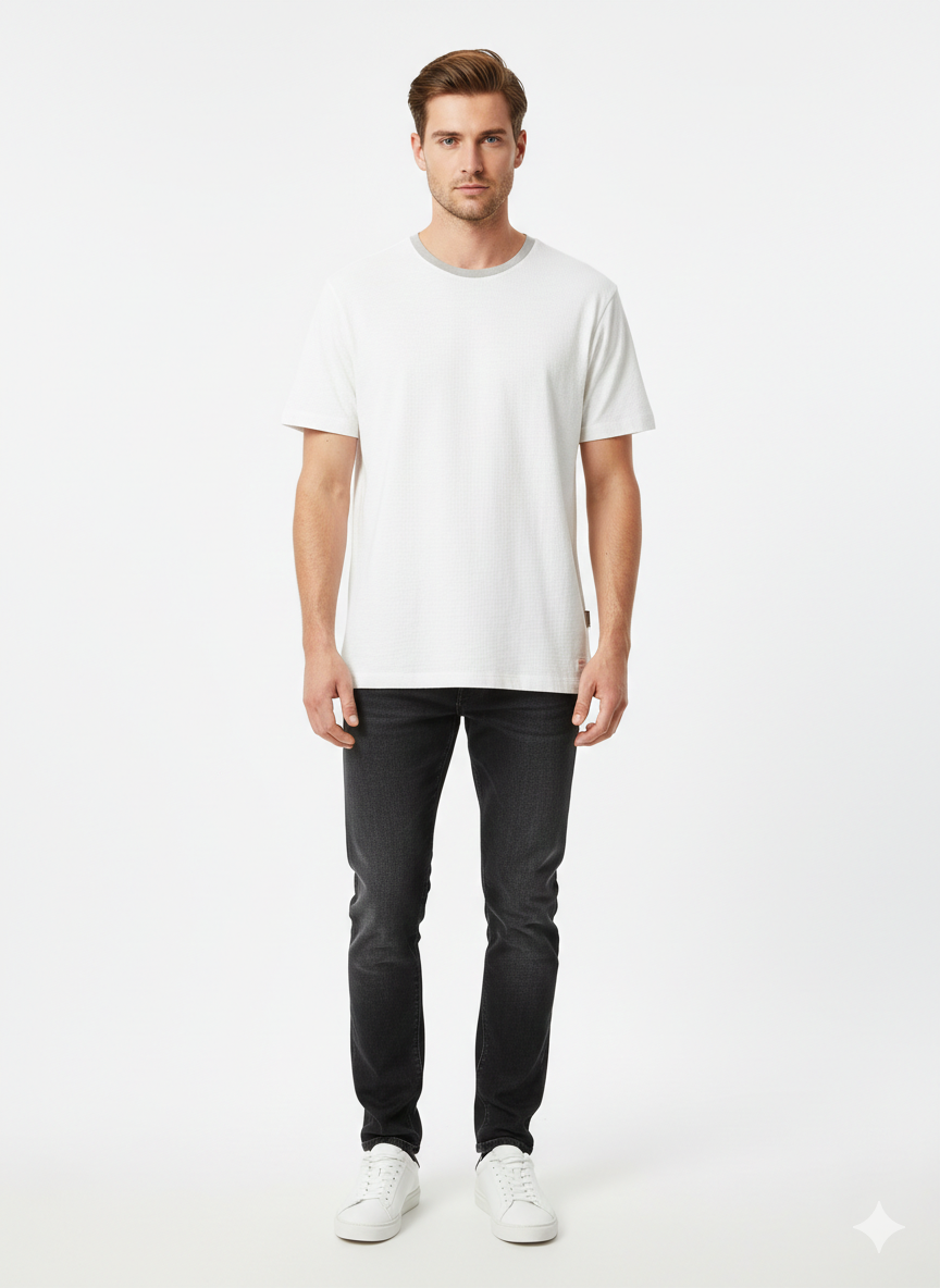 Man wearing a white t-shirt and black pants on a white background