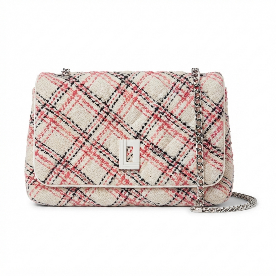 A tweed shoulder bag with a cream, pink, and black plaid pattern, featuring a silver-tone turn-lock clasp and a silver chain strap, shown against a plain white background.