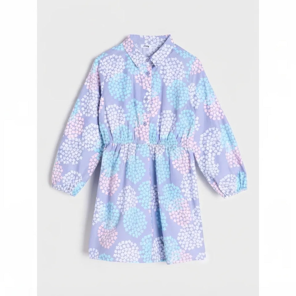 A long-sleeve collared shirt dress with a gathered waist, featuring a pastel purple, light blue, and pink floral pattern, displayed flat against a light gray background.