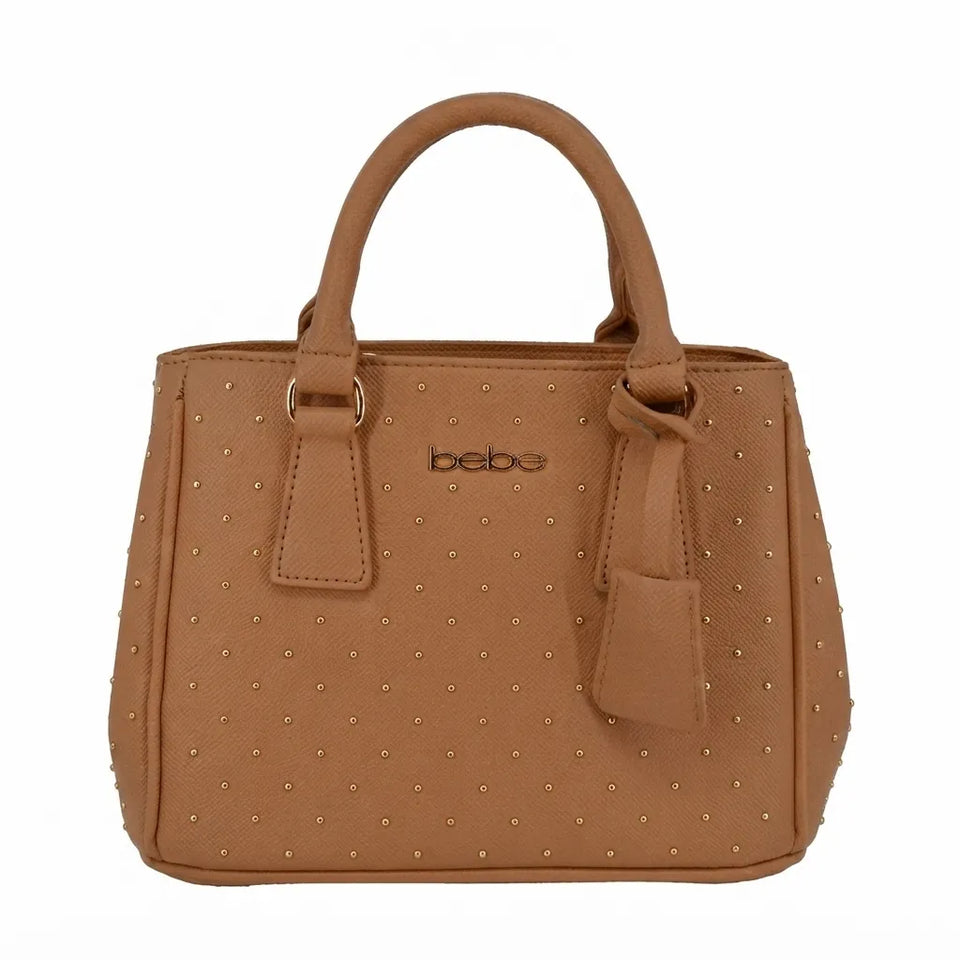 A tan faux-leather handbag with a studded ostrich pattern, featuring dual top handles, a front hanging tag, and the brand name 'bebe' printed in black on the front.