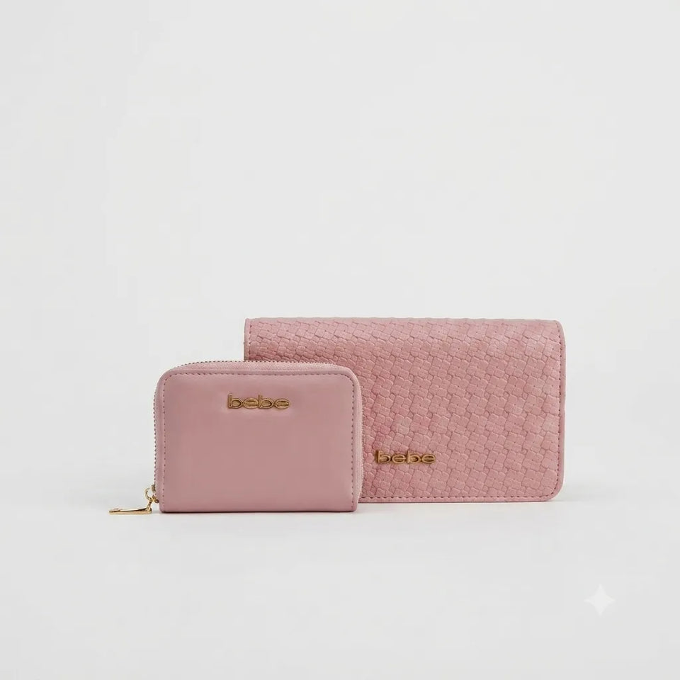 A pink textured leather wallet and matching zip-around card case with gold-tone 'bebe' branding, displayed on a clean white background.