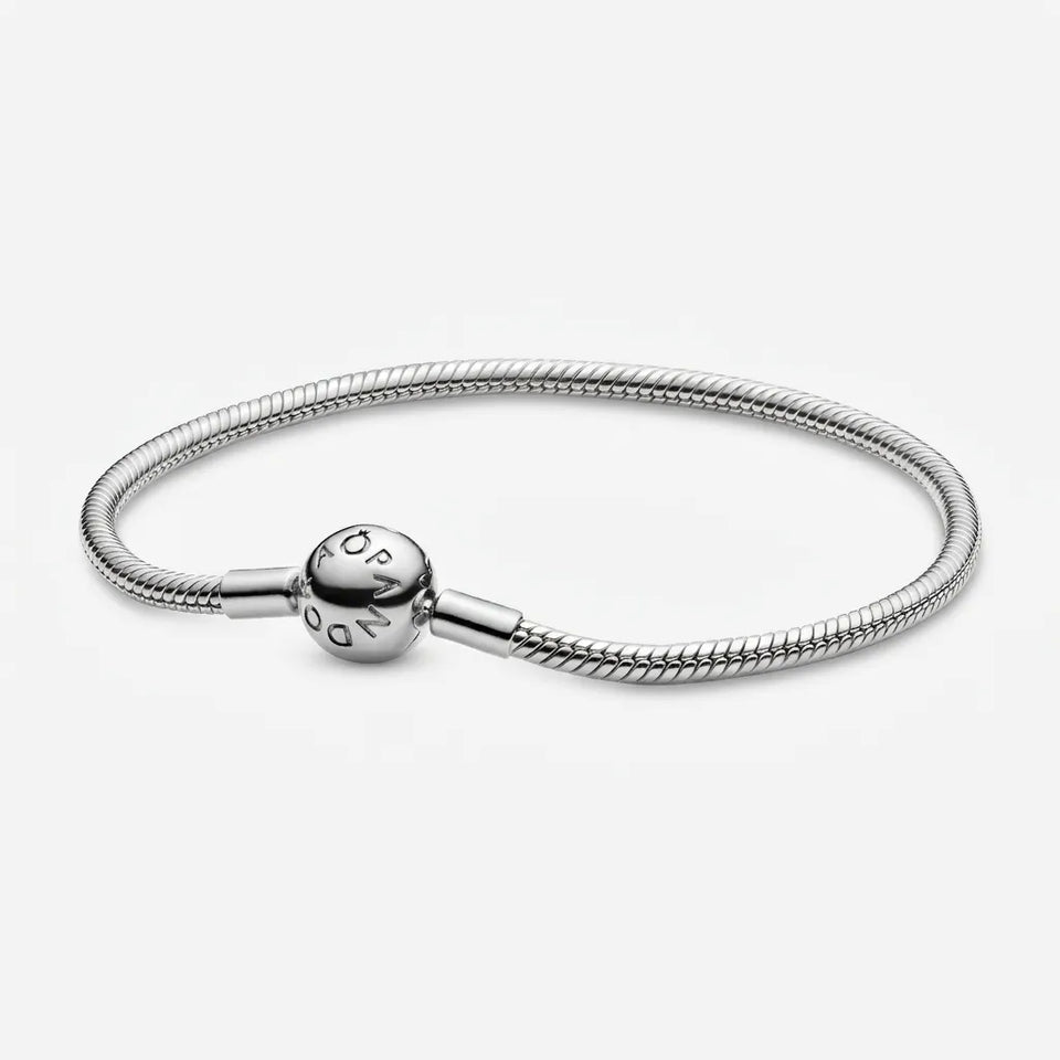 Silver bracelet with a heart-shaped clasp on a white background
