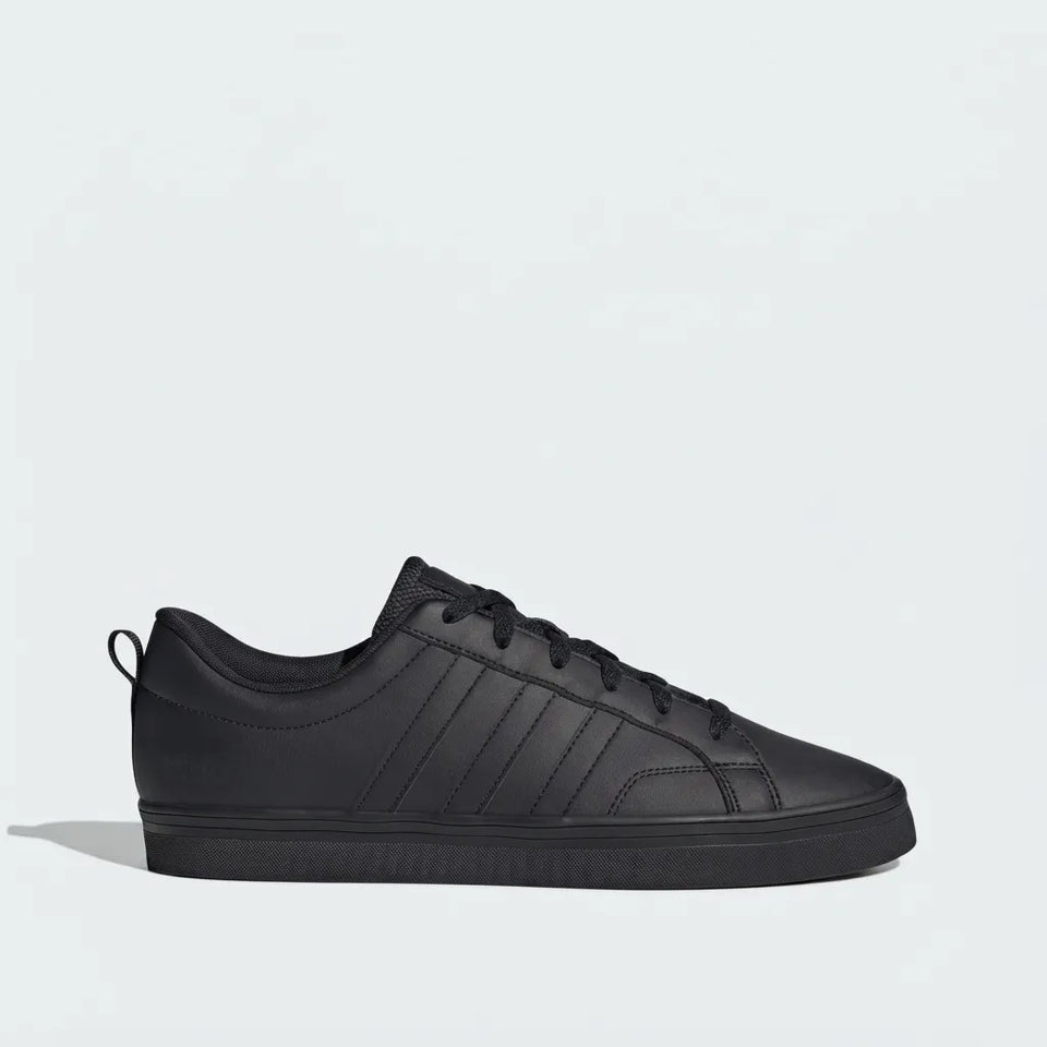 A light mint green leather low-top sneaker with matching green laces and a thick white sole, shown in a side profile on a solid white background.