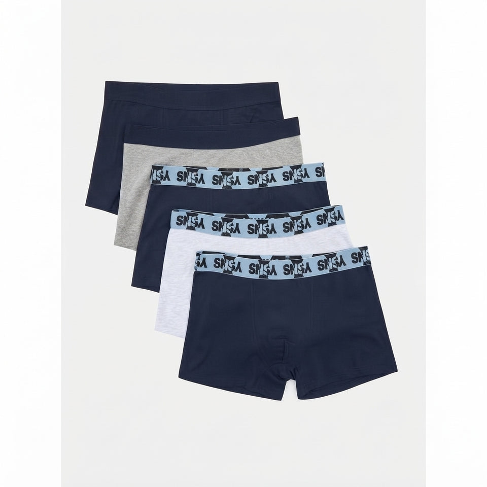A 4-pack of men's boxer briefs in navy, heather gray, white, and light blue, arranged in a staggered stack. The waistbands feature a light blue patterned band with the brand name 'SNSA' printed repeatedly in black.