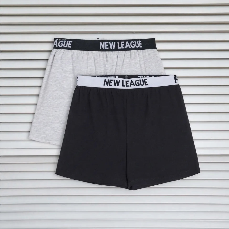 Two pairs of boxer briefs laid flat on a white slatted background: one light gray and one black, both with elastic waistbands printed with the brand name NEW LEAGUE.