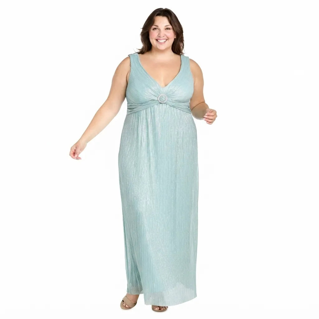 A woman modeling a sleeveless, floor-length light blue-green dress with a V-neckline, gathered waist detail, and a textured, pleated appearance against a plain white background.
