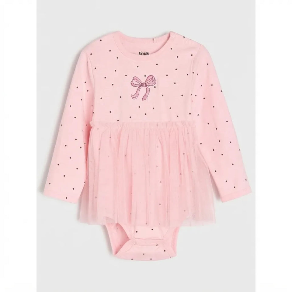 A baby girl's long-sleeve bodysuit in light pink, featuring a polka dot pattern, a pink bow graphic on the chest, and a matching tulle tutu skirt. The brand name 'L'Amour' is visible on the inner neck label.