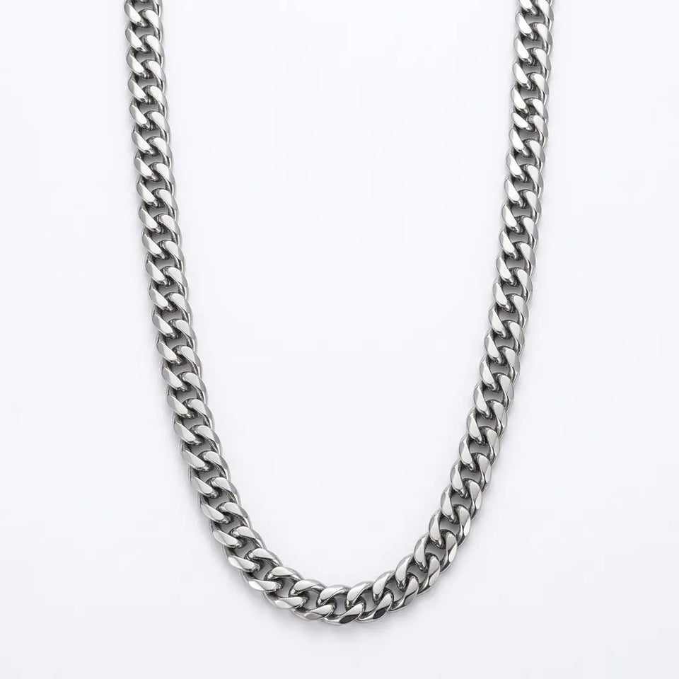 A silver-toned metal chain necklace with a curb link design, photographed against a clean white background.