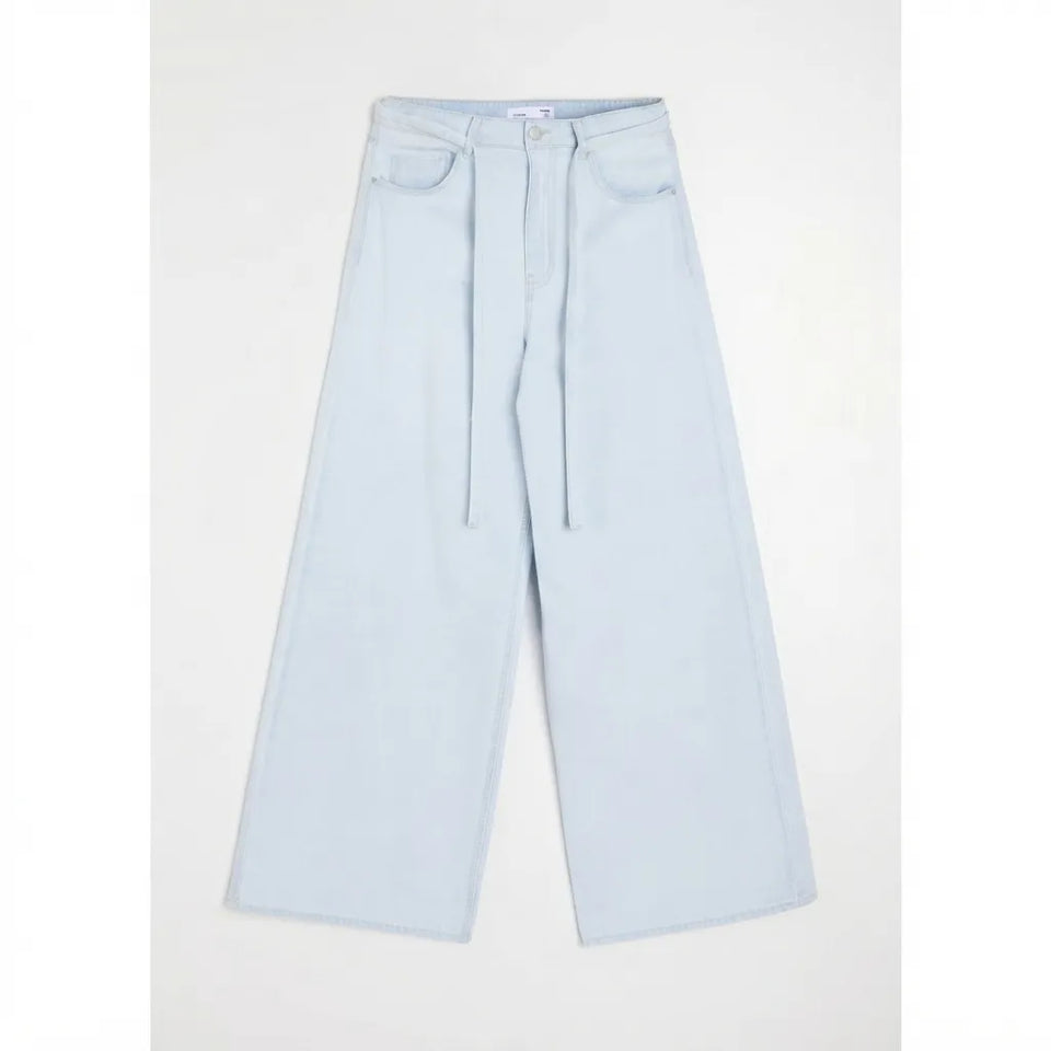 Light blue wide-leg cropped jeans with a drawstring waist, displayed flat against a light gray background.