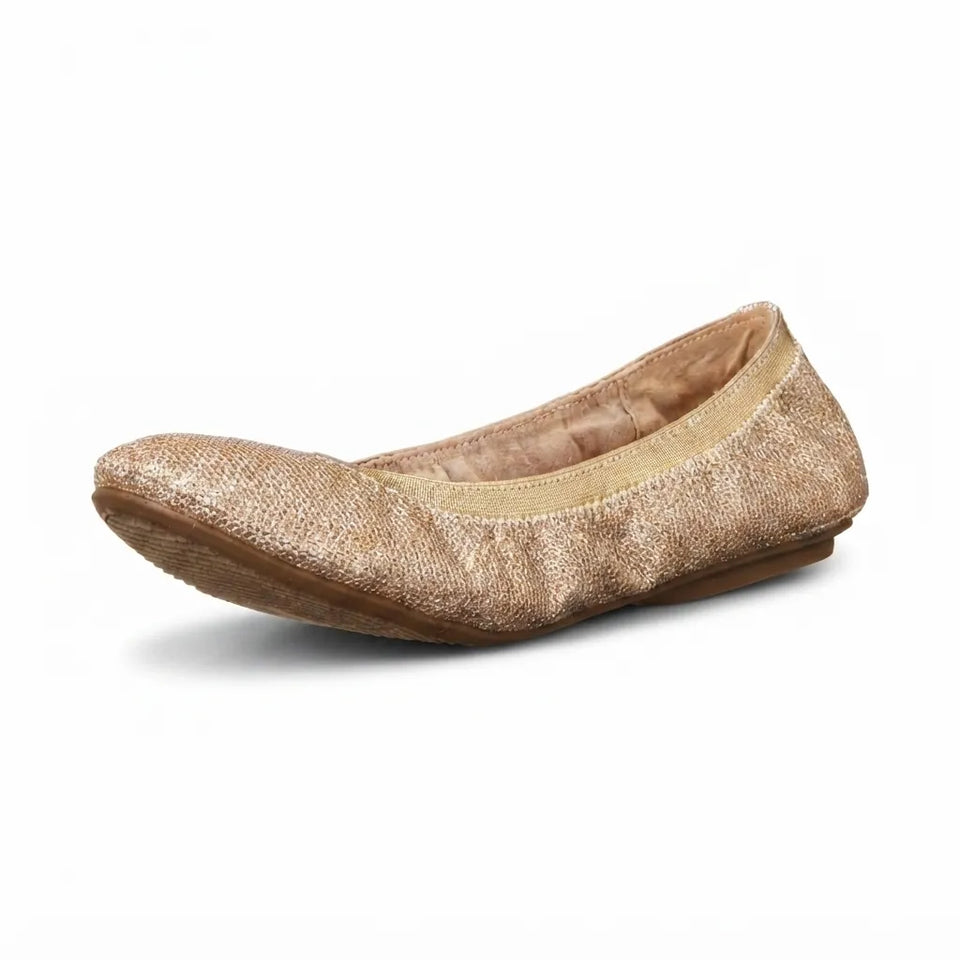 A single metallic gold glitter flat shoe with a tan lining and brown sole, shown from a side profile on a white background.