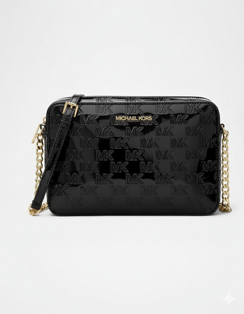 Black quilted handbag with gold chain strap on a white background
