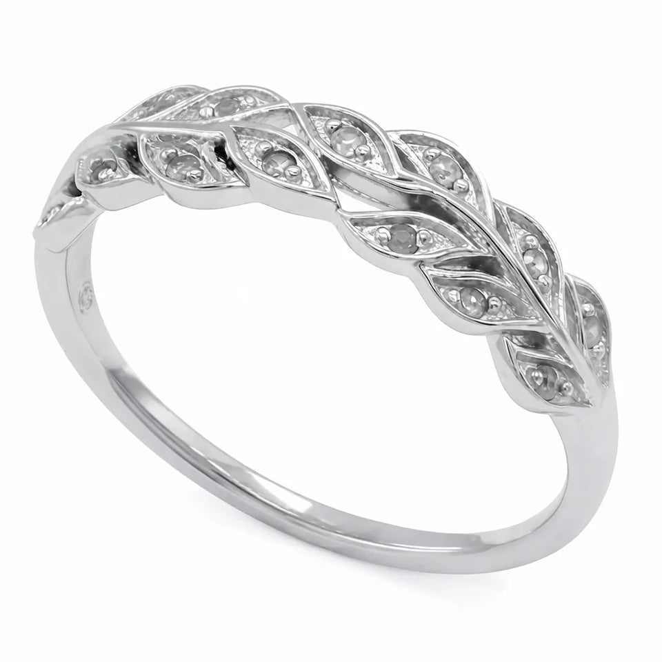 A silver leaf-patterned band ring with small clear stones set along the top, shown on a plain white background.