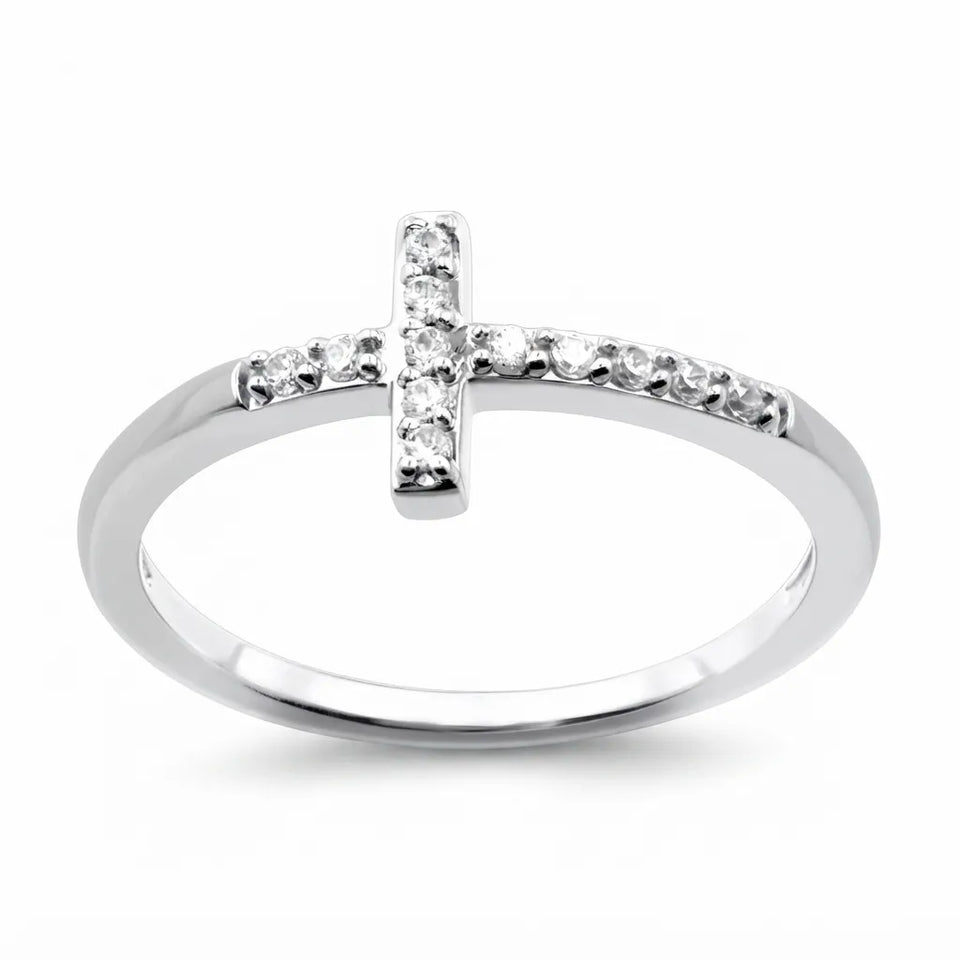 A silver cross ring with small clear stones set along the top of the band, shown on a plain white background.