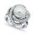 A silver ring featuring a large white pearl surrounded by multiple swirling bands of small clear stones, photographed on a clean white background.