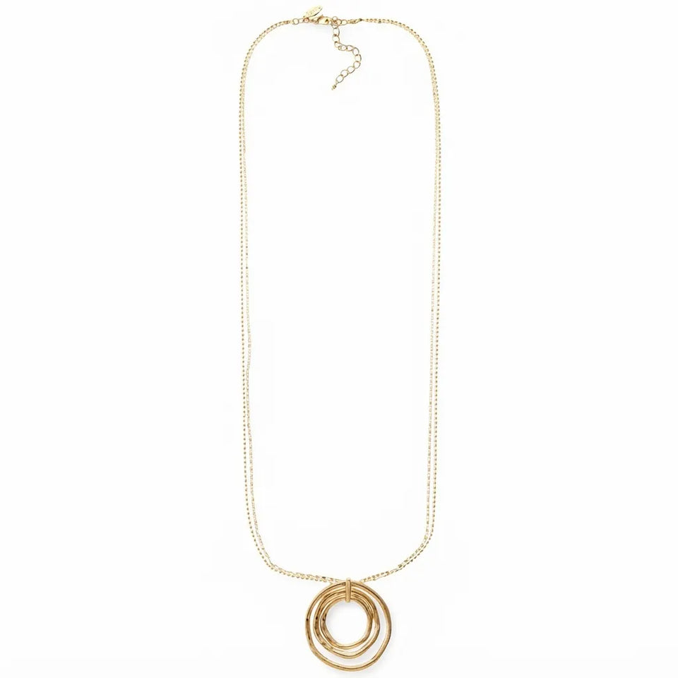 A gold chain necklace featuring a pendant made of three stacked, textured circular rings, displayed against a solid white background.