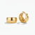A pair of polished gold hoop earrings shown on a clean white background, with one earring standing upright to display the interior clasp mechanism and the other lying flat to show the exterior curve.