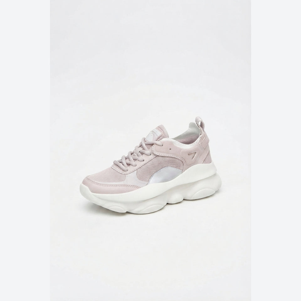 A single chunky sneaker in a pale pink and white colorway, shown from a three-quarters angle against a clean white studio background.