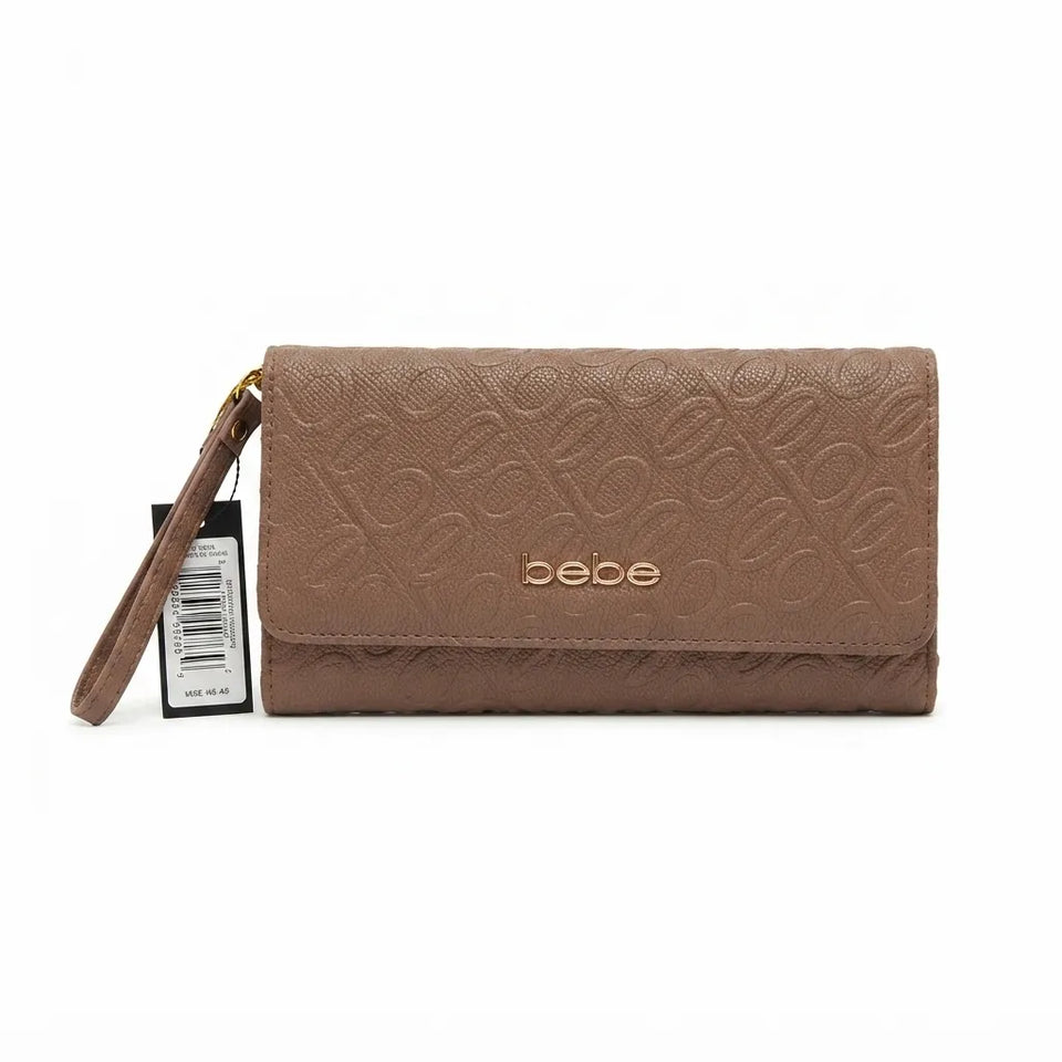 A brown embossed leather wallet with a wristlet strap and a gold-tone logo on the front, shown with its retail tag against a plain white background.