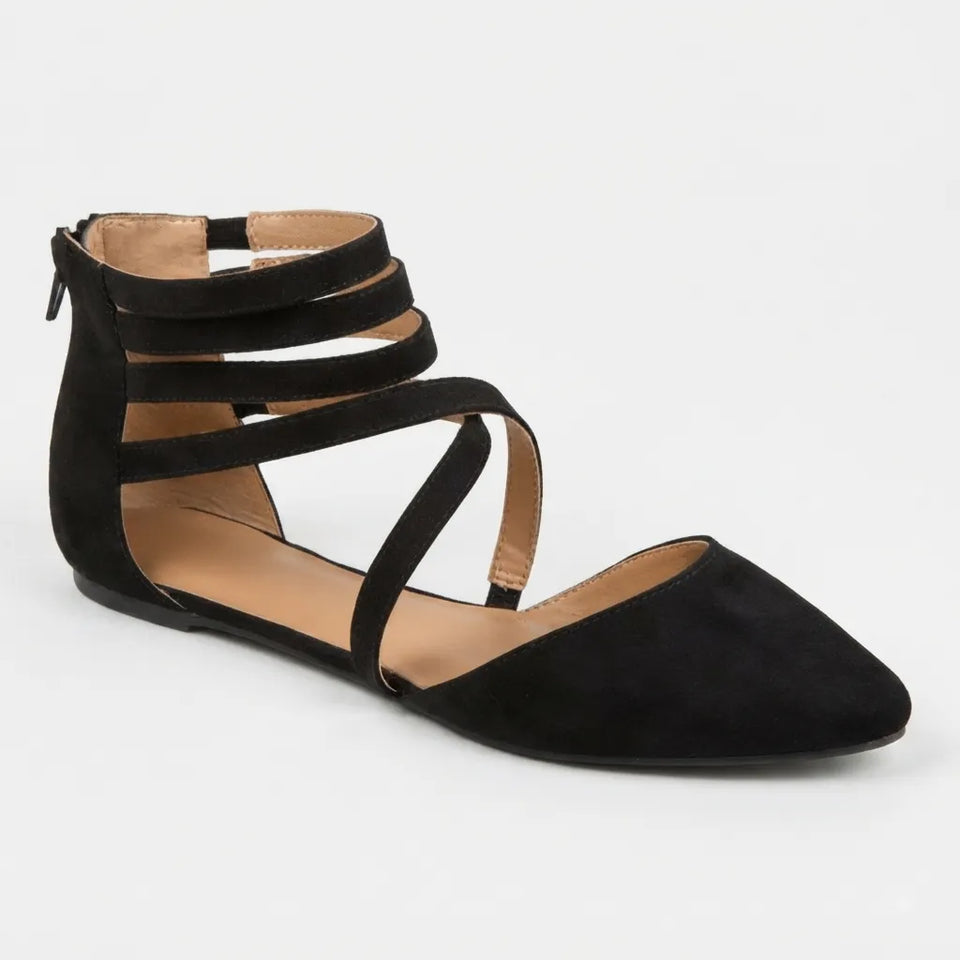 A black pointed-toe flat sandal with multiple wraparound ankle straps, shown from a side profile on a light gray background.