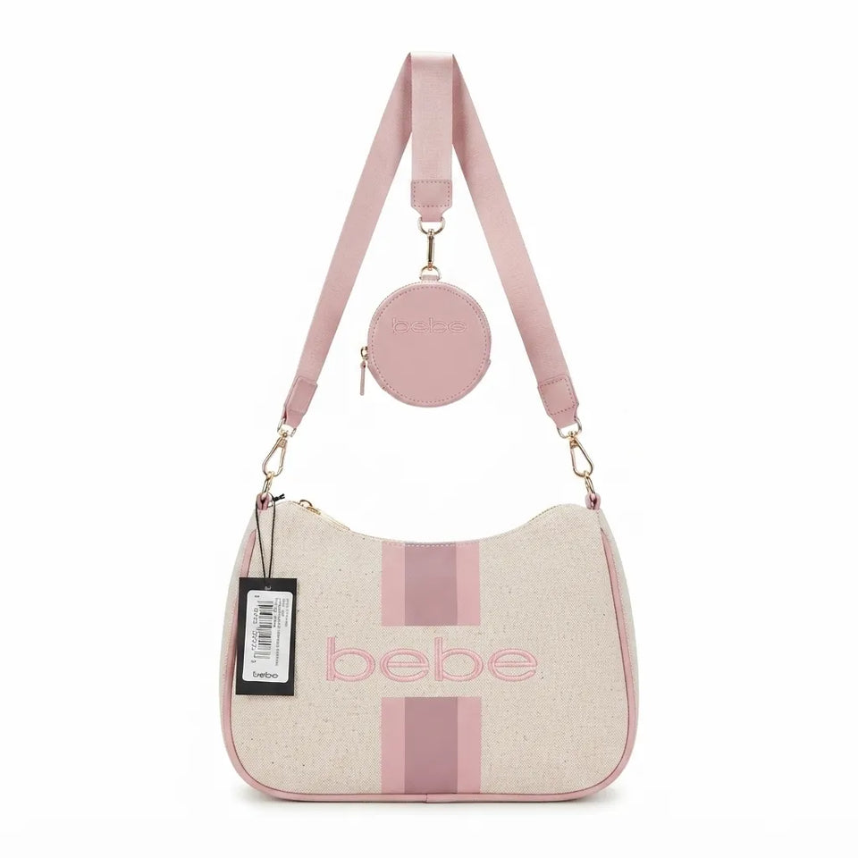 A light pink and beige shoulder bag with a matching round coin pouch and shoulder strap, featuring the brand name 'bebe' in pink on the front, set against a plain white background.