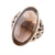 An oval smoky brown glass stone ring set in an antique gold-toned metal band with ornate floral detailing, shown on a plain white background.