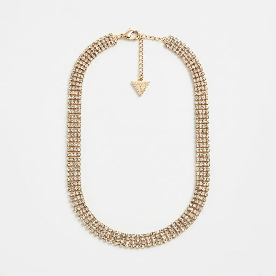 A gold-toned multi-row rhinestone collar necklace with a small triangular charm, displayed on a clean white background.