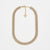A gold-toned multi-row rhinestone collar necklace with a small triangular charm, displayed on a clean white background.
