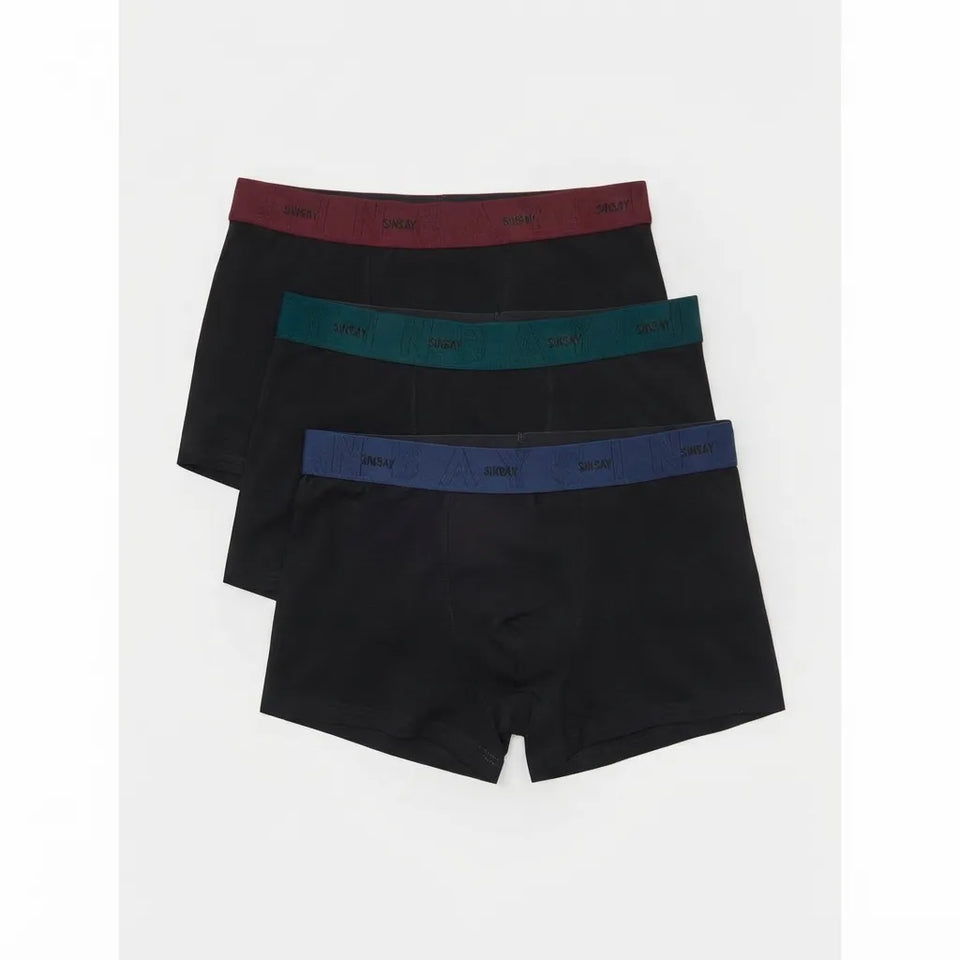 Three pairs of men's boxer briefs stacked diagonally on a light gray background. The front pair is black with a blue waistband, the middle pair is black with a teal waistband, and the back pair is black with a burgundy waistband.