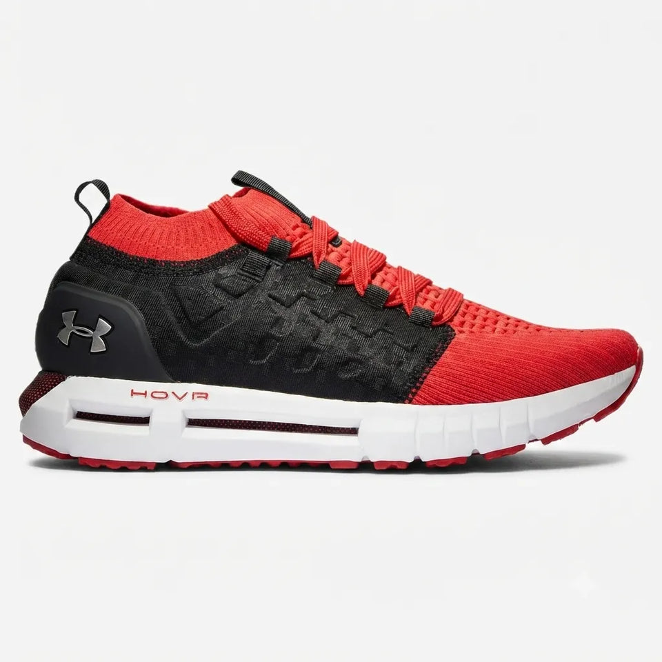 A red and black Under Armour Flyknit sneaker with a white midsole and red accents, shown in a side profile on a light gray background.
