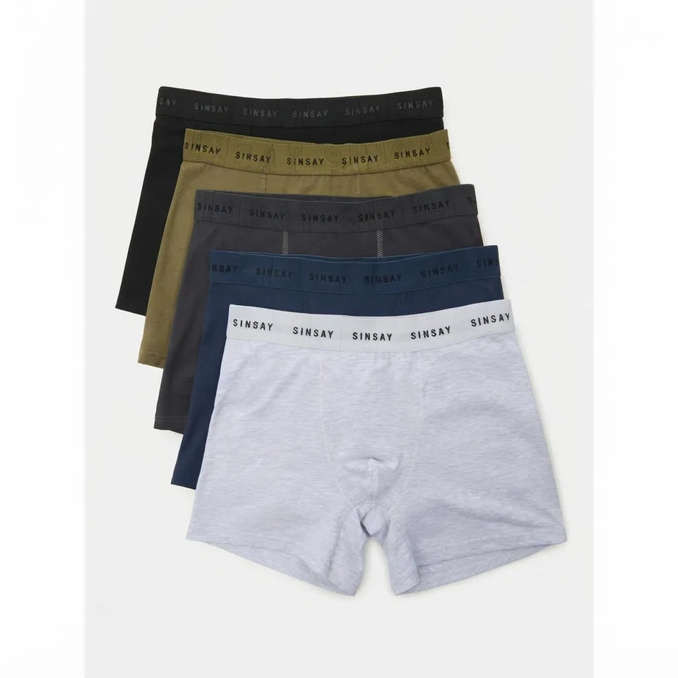 A set of five SinSay men's boxer briefs in different colors (black, olive green, charcoal gray, navy blue, and light heather gray) arranged in a fan shape on a light gray background.