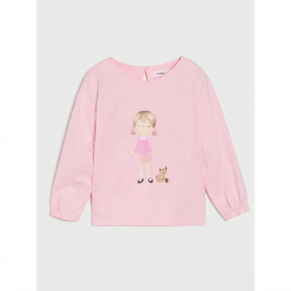 A light pink long-sleeve crewneck top for kids, featuring a cartoon illustration of a girl with pigtails in a pink dress and a small cat on the front, displayed against a neutral light gray background.