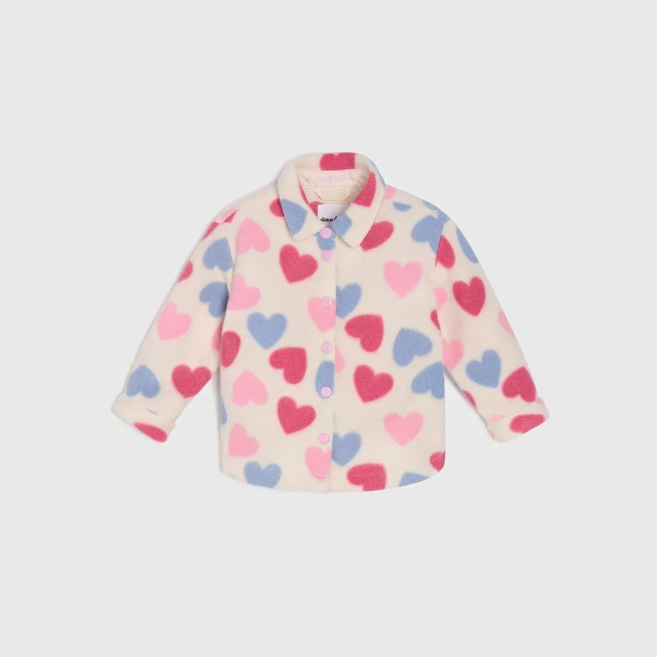 A long-sleeve button-up shirt for toddlers, featuring a playful pattern of pink, red, and blue hearts on a cream-colored background, displayed against a light gray studio backdrop.
