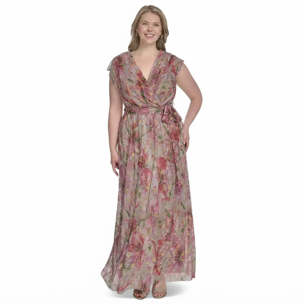 A woman modeling a floor-length floral wrap dress with cap sleeves and a matching waist tie, shown against a plain white background.