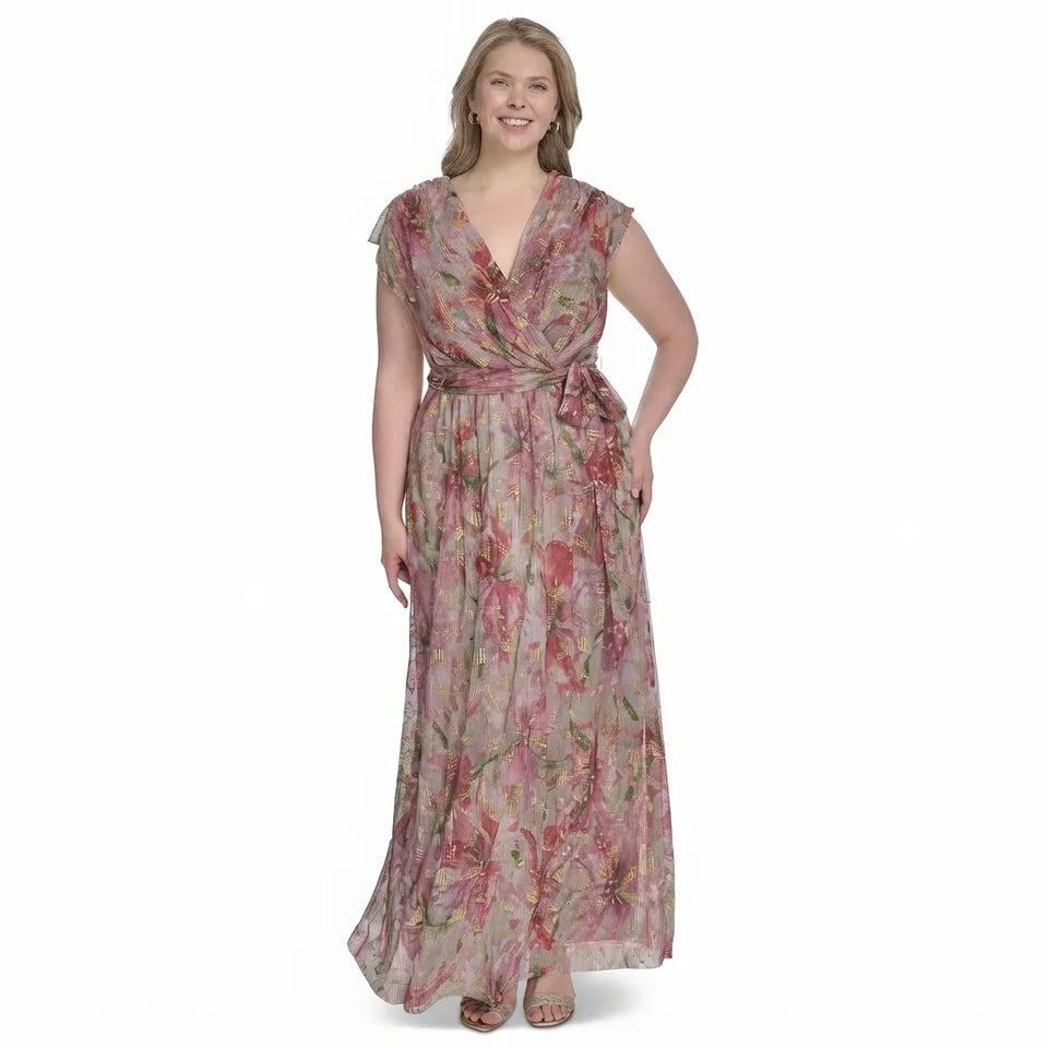 A woman modeling a floor-length floral wrap dress with cap sleeves and a matching waist tie, shown against a plain white background.