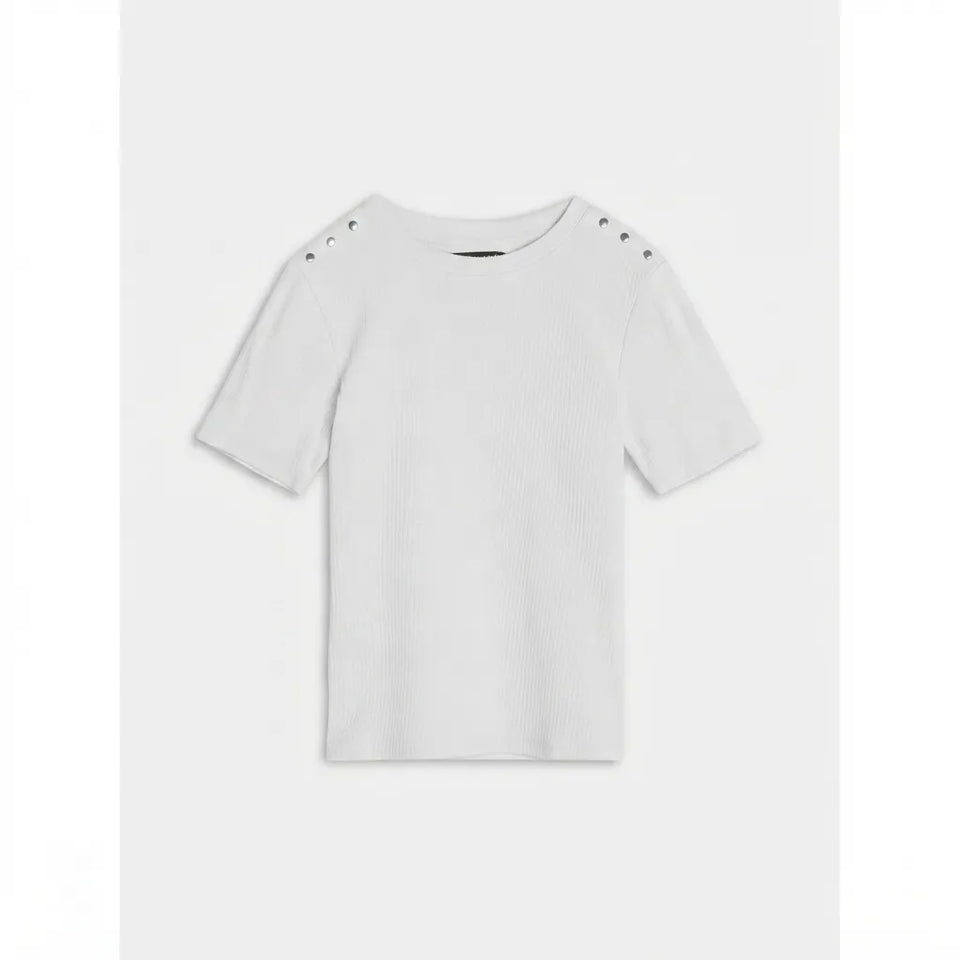 A white short-sleeve knit top with three metal eyelet details on each shoulder, displayed flat against a light gray background.