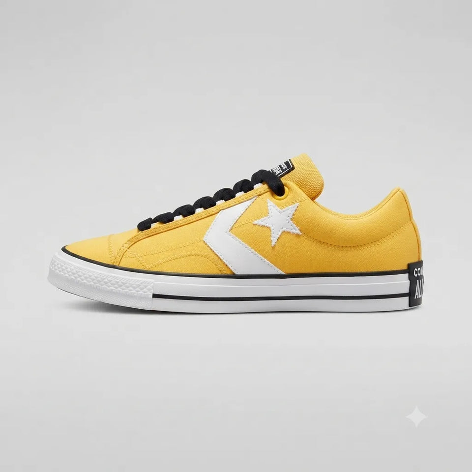 A yellow Converse All Star low-top sneaker with a white star logo, white rubber sole, and black laces, shown in a side profile on a light gray background.