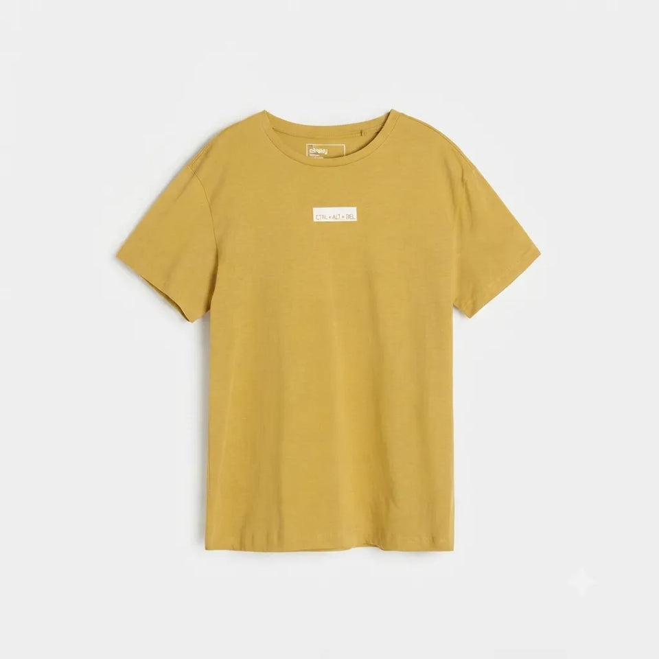 A mustard yellow short-sleeve crewneck t-shirt with a small white rectangular label on the chest, displayed flat against a light gray background.