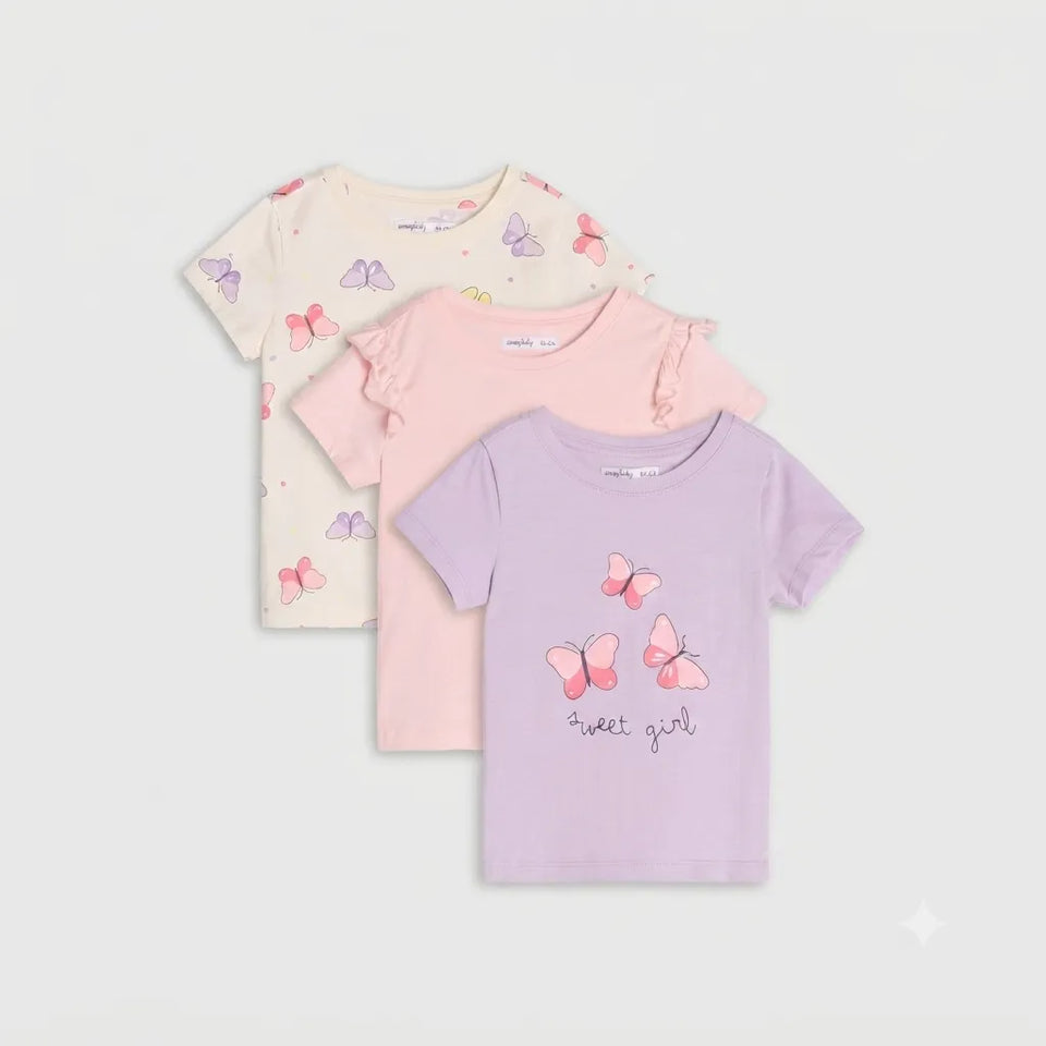 Three children's short-sleeve T-shirts in pastel colors, arranged in a fan layout on a light gray background. The front shirt is lavender with pink butterflies and the text 'sweet girl', the middle is light pink, and the back is cream with pink and purple butterflies.