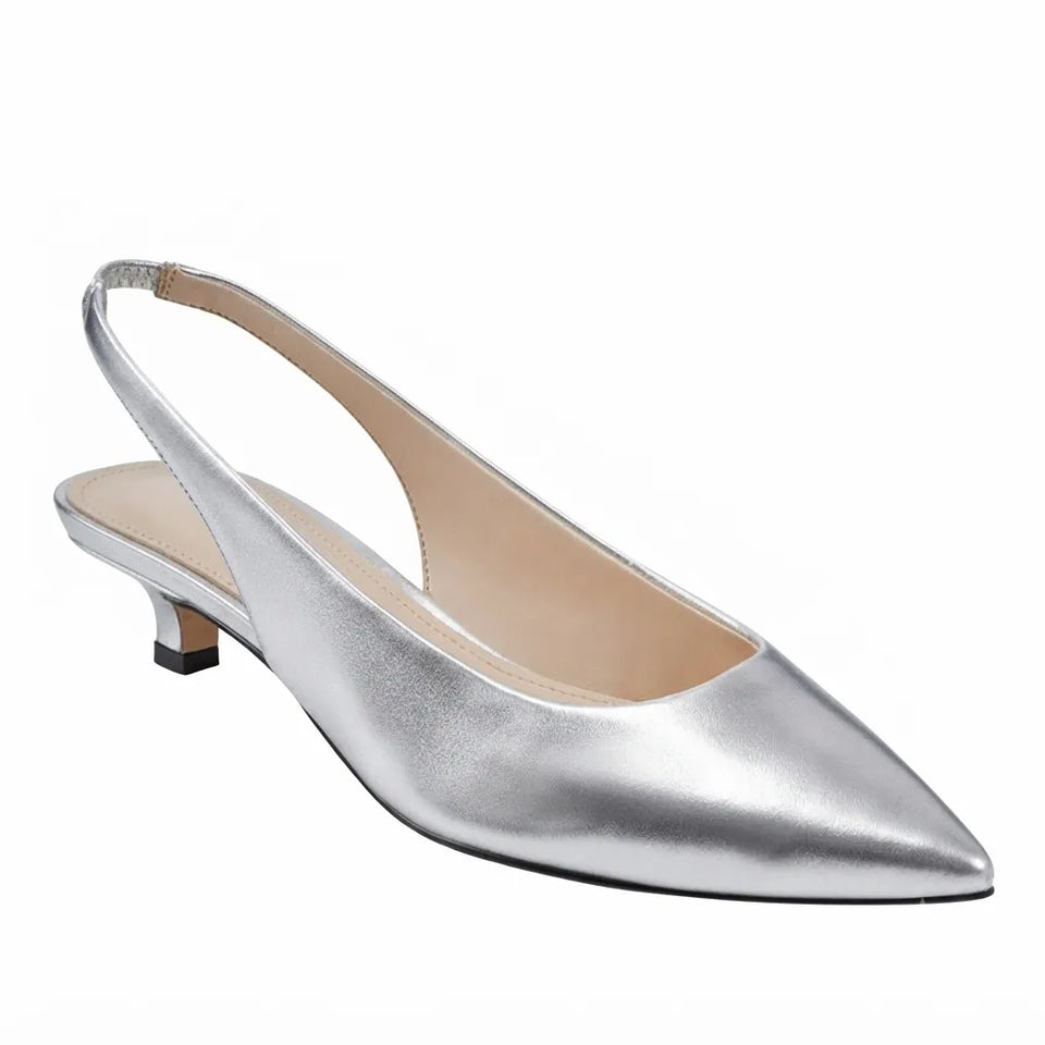 A single metallic silver slingback pump with a pointed toe and a low kitten heel, shown from a three-quarters angle on a white background.