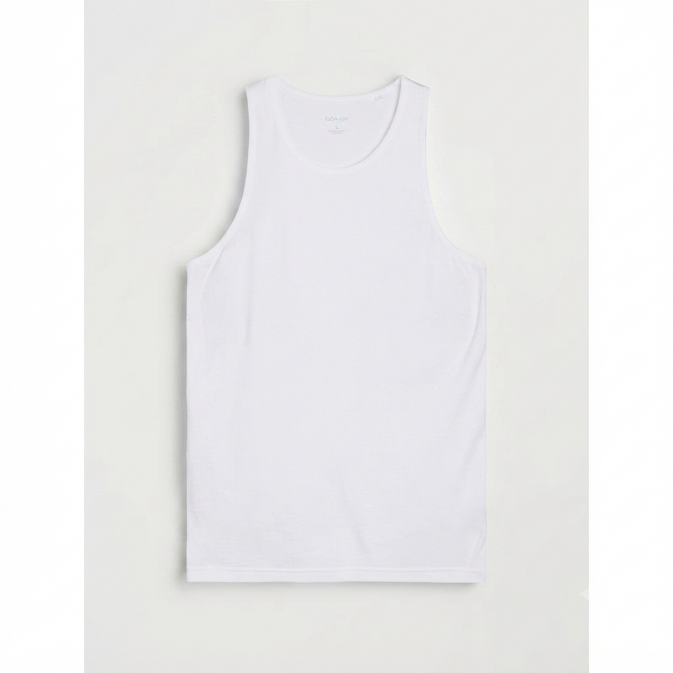 A plain white sleeveless tank top laid flat against a light gray background.