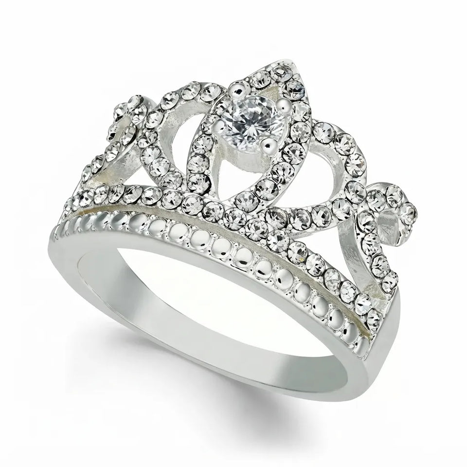 A silver crown-shaped ring adorned with clear rhinestones and a central clear gemstone, shown on a clean white background.