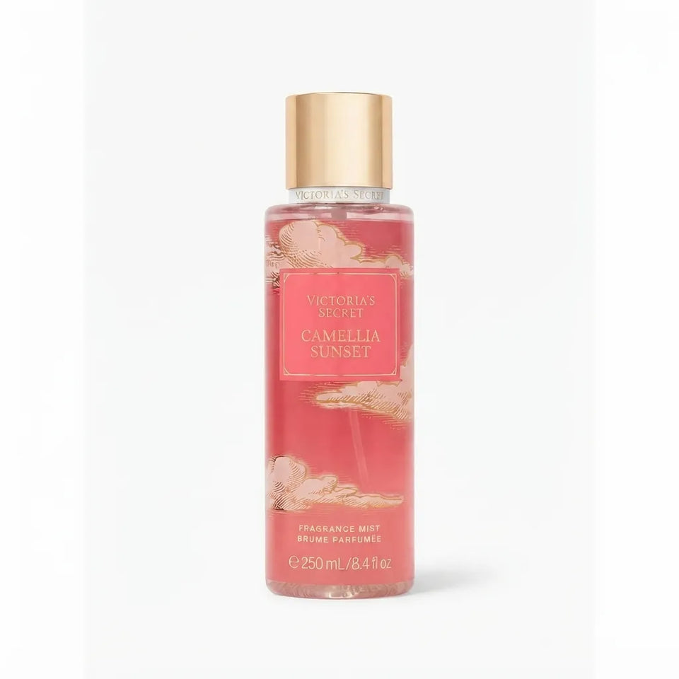 Victoria's Secret Camellia Sunset Fragrance Mist in a clear bottle with pink liquid, a gold cap, and a pink label, shown on a white background.