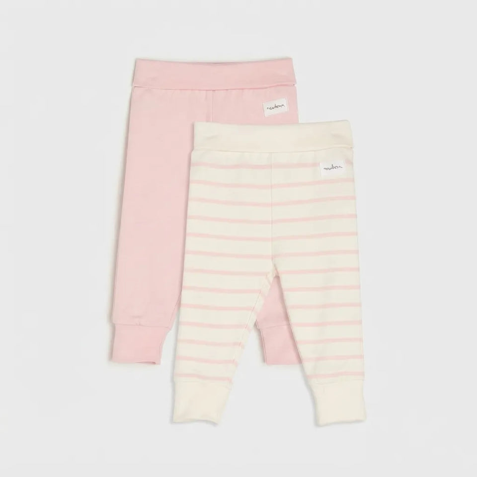 Two pairs of baby leggings from the brand Nuna, displayed flat against a light gray background. The pair in the back is solid light pink, and the pair in the front is cream with thin pink horizontal stripes.