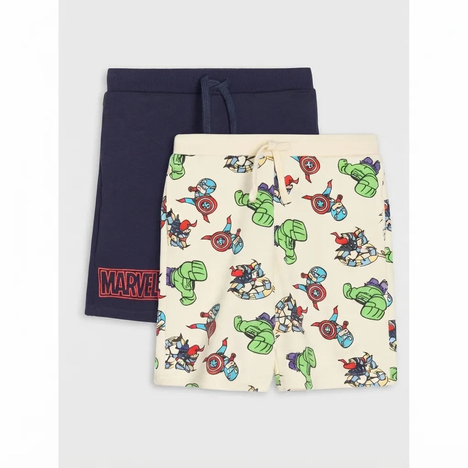Two pairs of kids' drawstring shorts laid flat on a light gray background. The back pair is solid navy blue with a red Marvel logo patch near the hem.