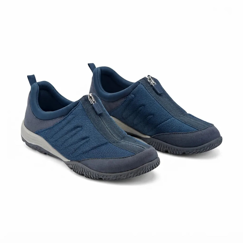 Pair of blue casual shoes with zippers on a white background