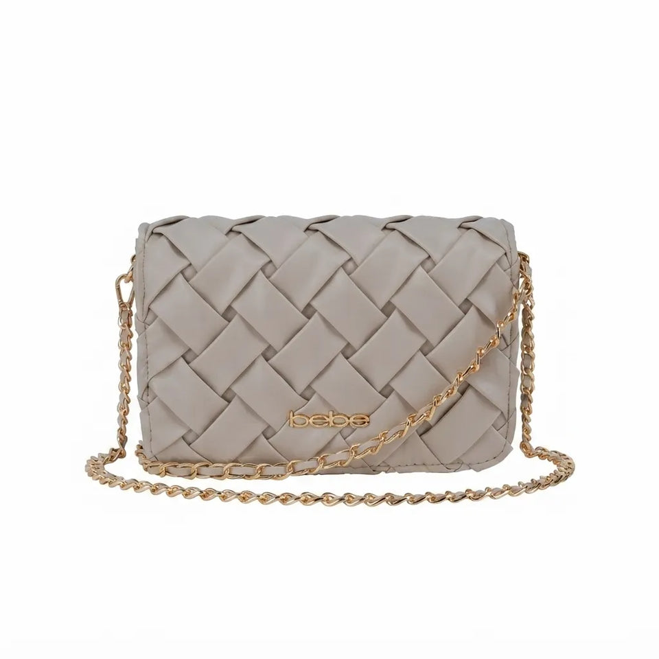 A light taupe woven leather crossbody bag with a gold-tone chain strap and a gold 'bebe' logo on the front, shown against a plain white background.