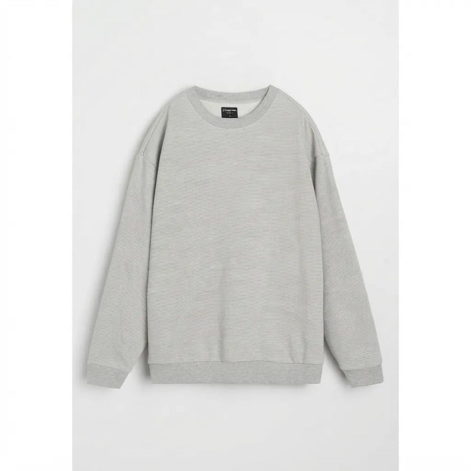 A light gray crewneck sweatshirt with long sleeves, laid flat against a light gray background.