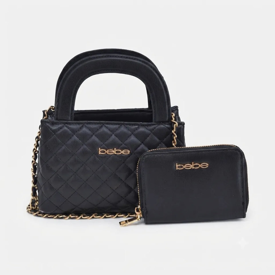 Black quilted handbag with a top handle, gold chain strap, and a matching zip-around pouch, both featuring the 'bebe' logo in gold on a light gray background.