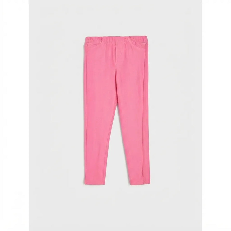 A pair of bright pink leggings with an elastic waistband, laid flat against a light gray background.
