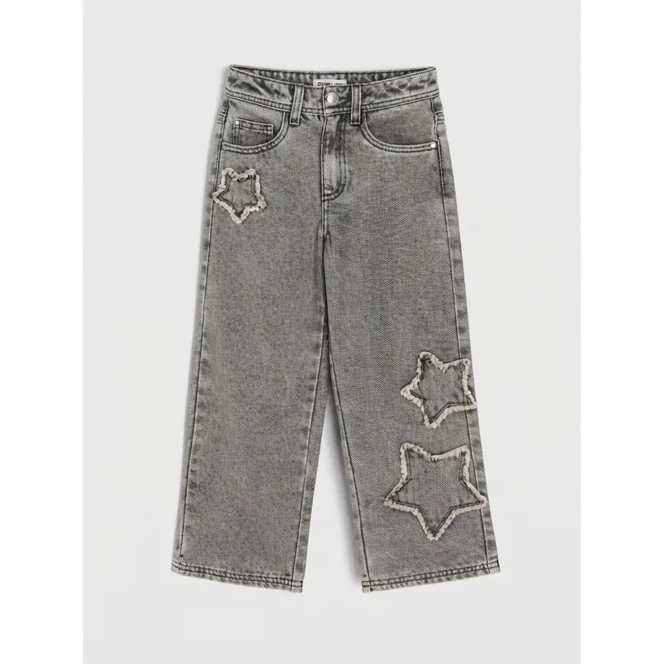 Gray denim jeans with three embroidered star patches on the front, photographed flat against a light gray background.